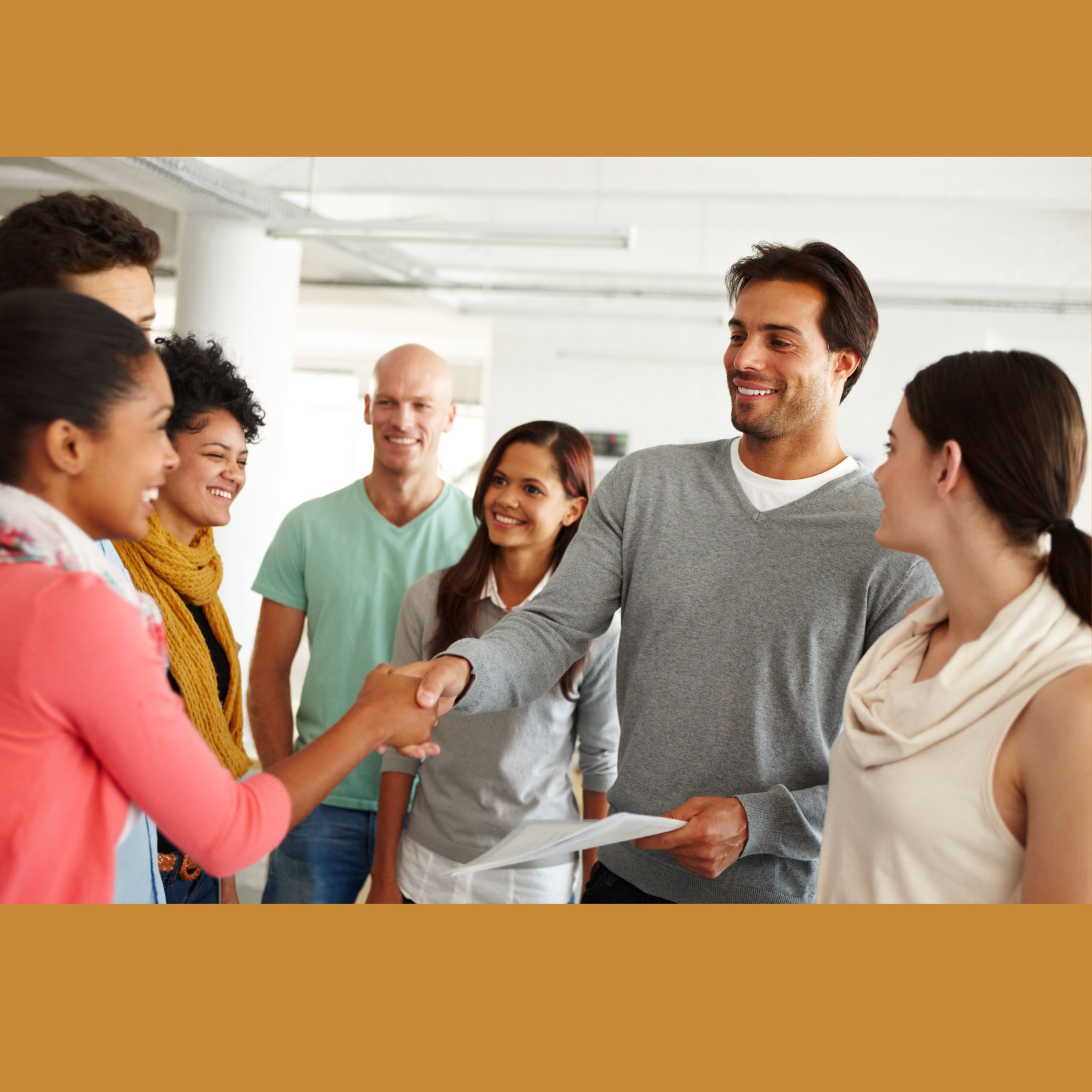 A group of older students greet each other.