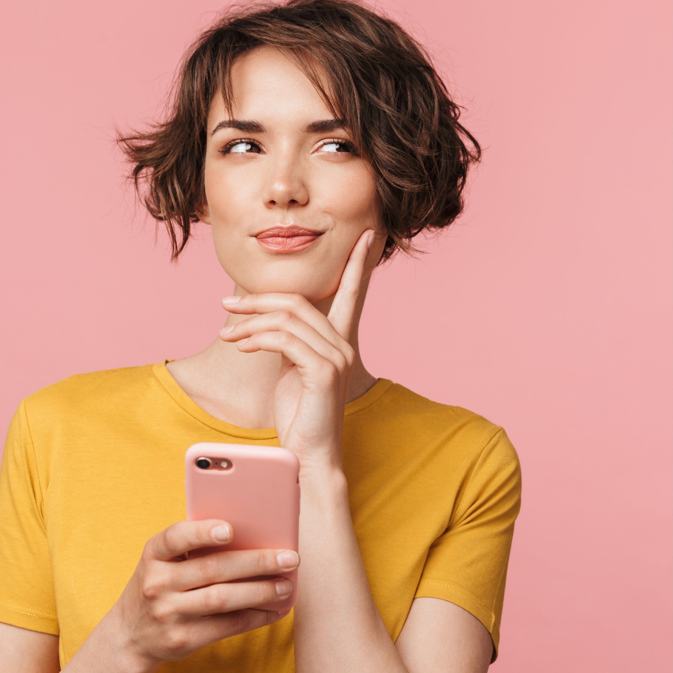 Decorative image of a woman thinking while holding her cell.