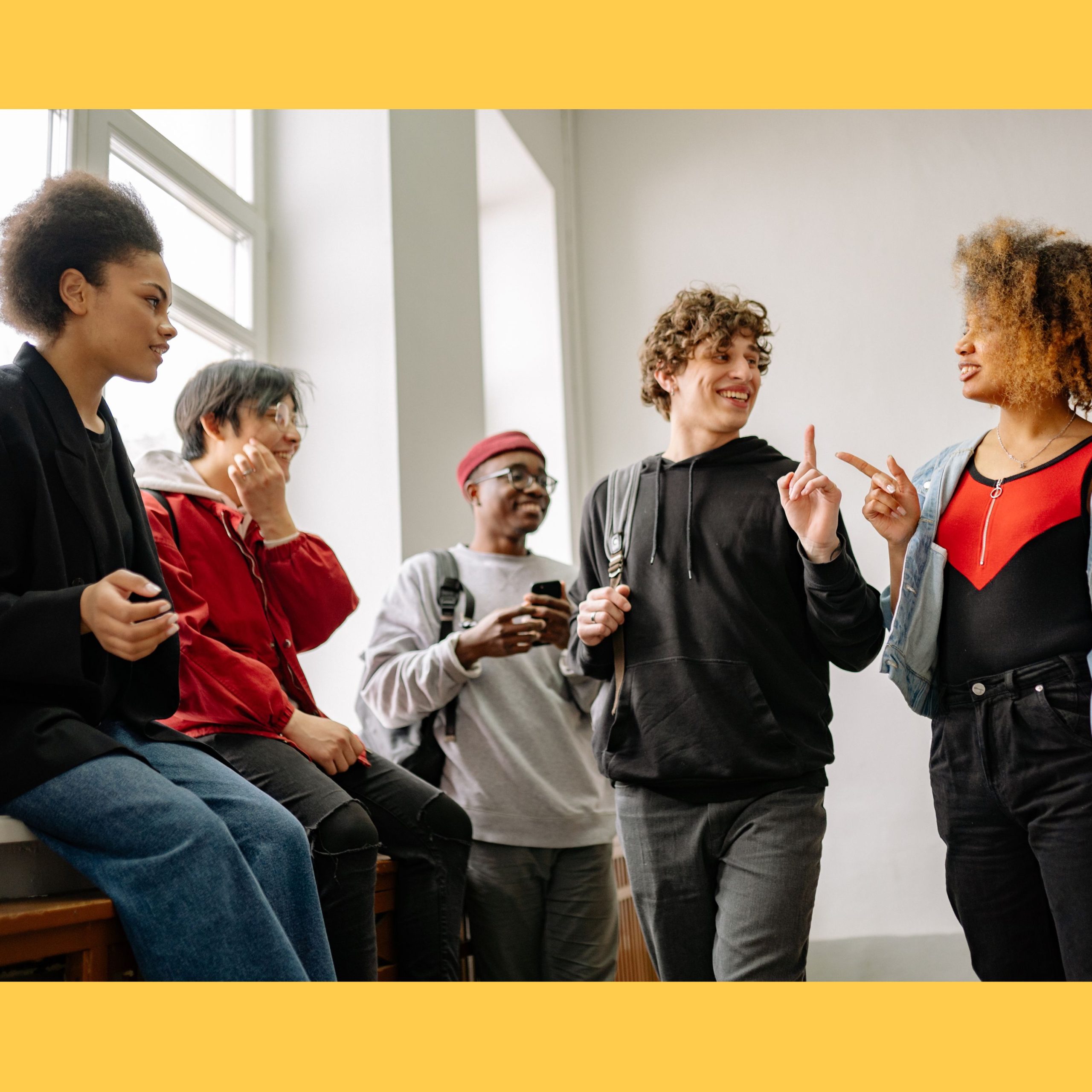 Decorative photo of students talking to each other.