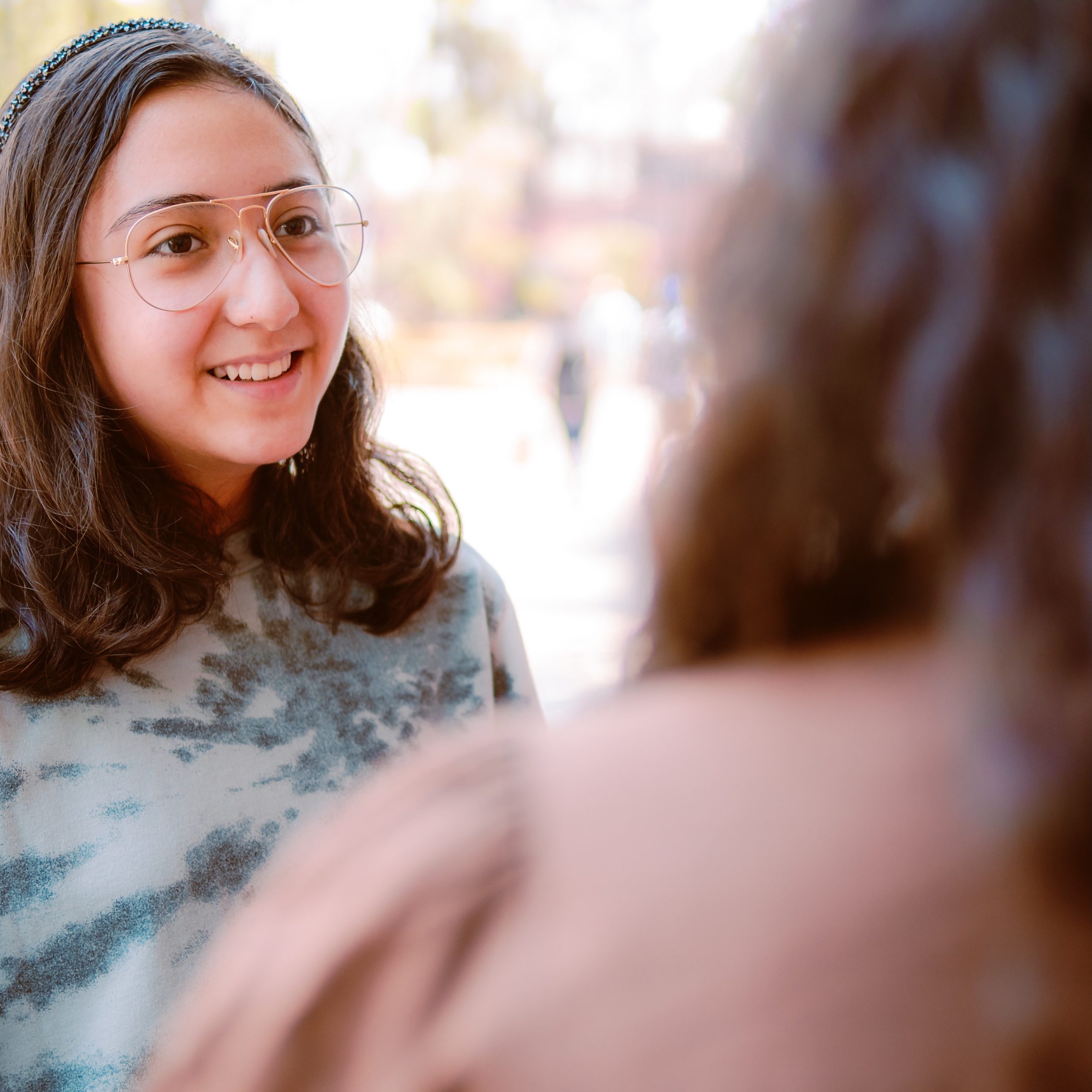 Decorative photo of two students talking