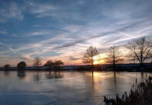 A winter sunset over a pond.