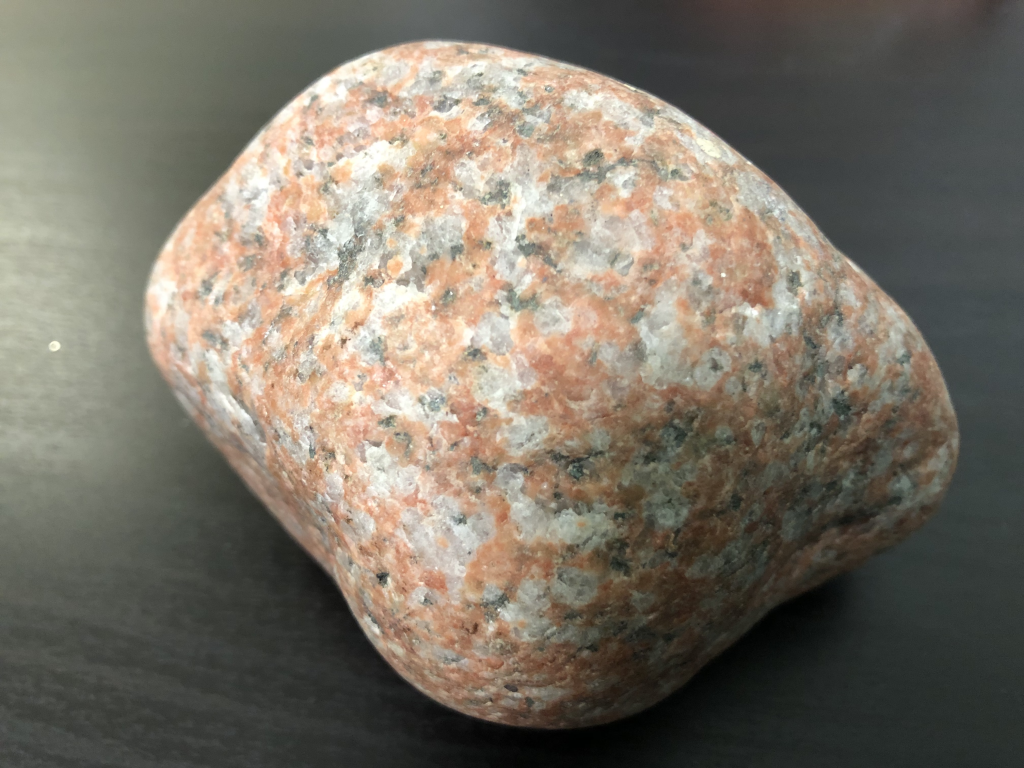 A photograph of a piece of granite, which contains different minerals.