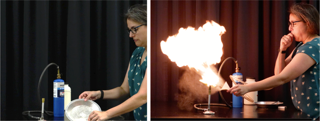 Two photographs. On the left is a photograph of Dr. Pasquale as she attempts to light a tray of lycopdium powder on fire with a match. Only the match is lit, with no flames spreading to the powder. On the right is a photograph of Dr. Pasquale as she blows powder through a funnel, dispersing the molecules. This causes a large fireball explosion. In the background of both photographs is a cylinder of propane gas, a plastic jar of lycopodium powder, and a matchbox.