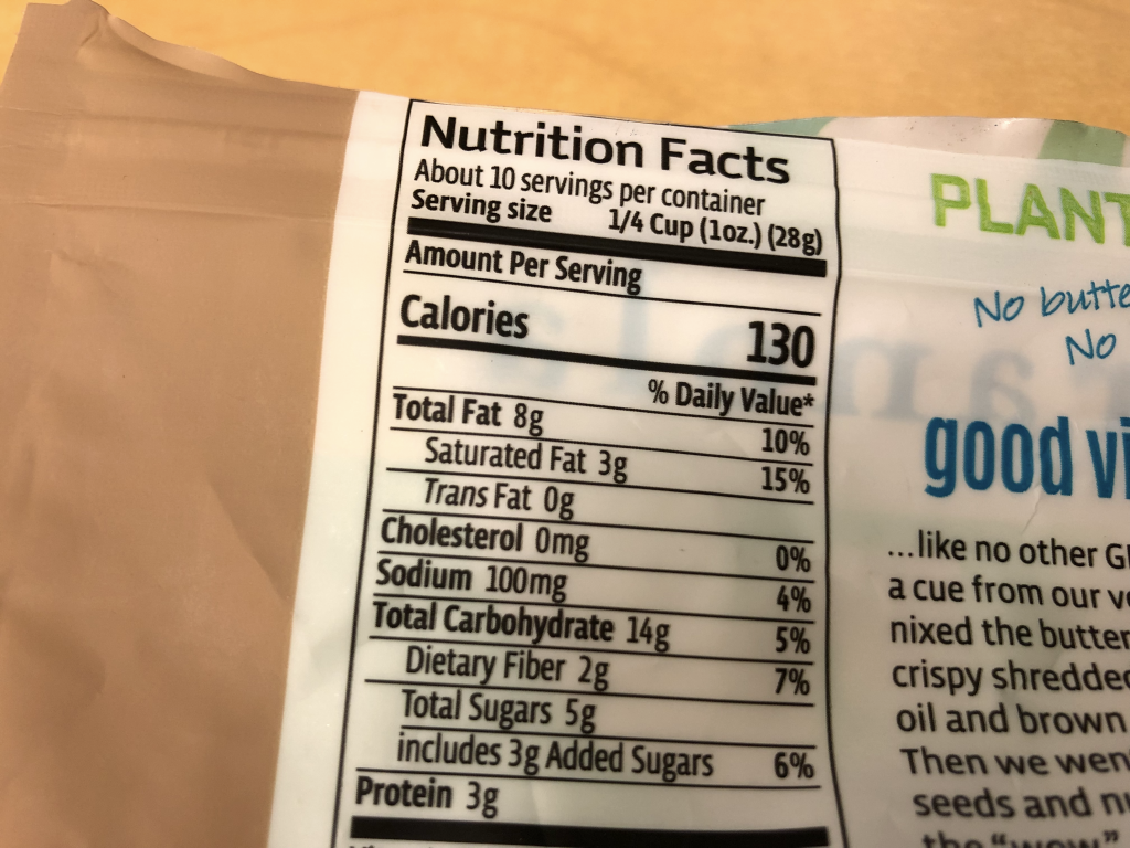 A photograph of a nutritional facts label for a package of granola. There are 130 Calories (large calories) per serving.
