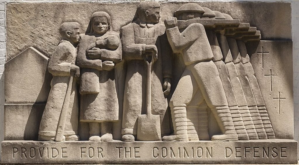 Stone carving reading "Provide for the common defense"