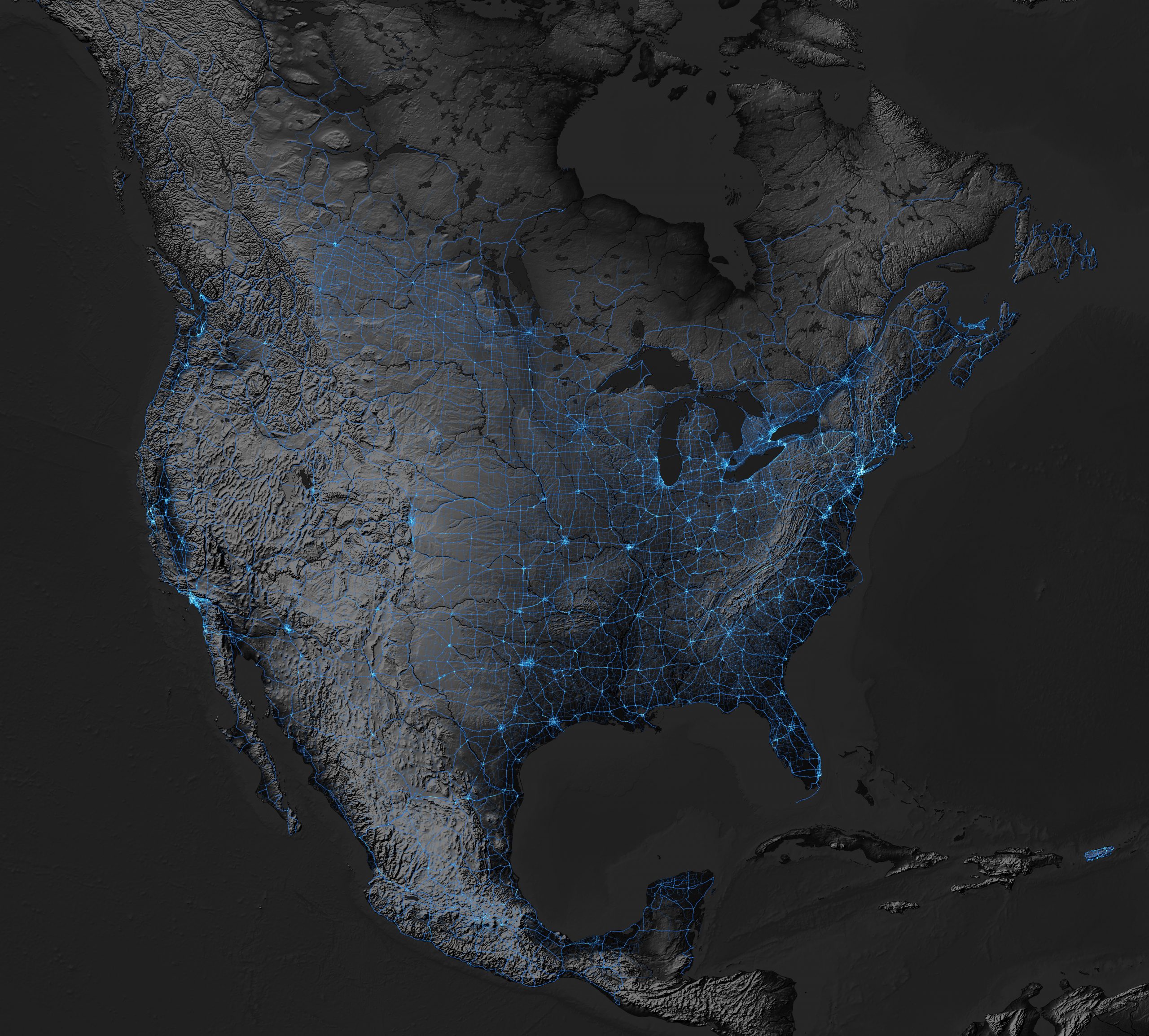 Map of North America at night, noting lighting of transportation networks.