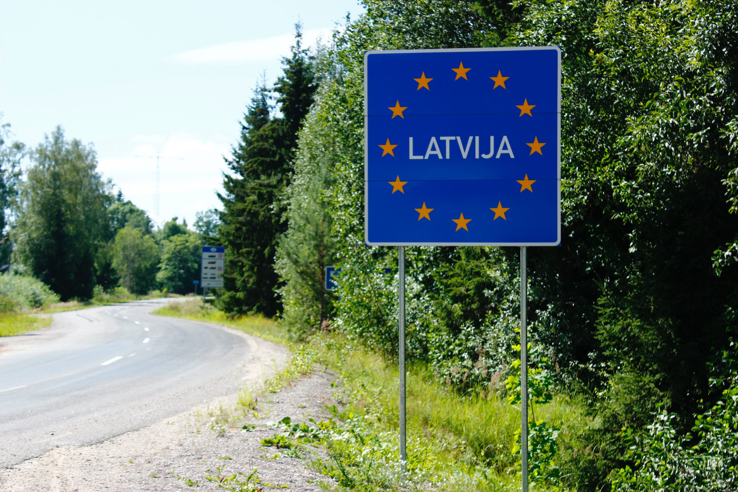 Photograph showing a Latvia sign at the border crossing.