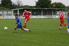 A photo of a soccer player earning a goal