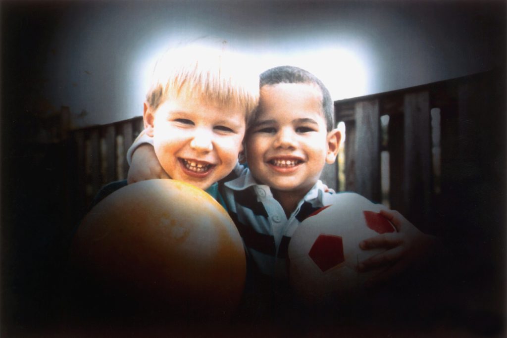 Photo showing two young children, adjusted to show vision with glaucoma. 