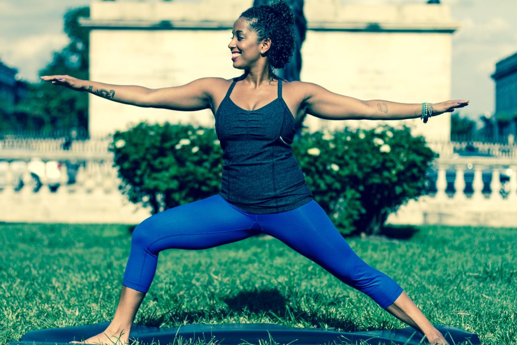 Photo showing a person in a yoga position outdoors