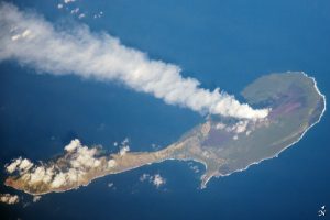 Aerial photography of a steam plume from a volcano on Pagan Island in the Northern Mariana Islands in the Pacific Realm.