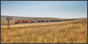 Photograph of a train moving across the Great Plains.