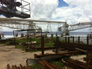 Photography of machinery to loaded phosphate deposits onto ships in Nauru in the Pacific Realm.