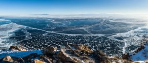 Panoramic photograph of icy Lake Baikal in Siberia.