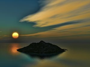 Sunset photo of tiny island in the South Pacific.