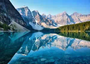 Stunning photograph of Moraine Lake, Banff, Alberta, Canada. Mountain lake scene where the water reflects the peaks.