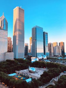 Photograph of Chicago skyline and park with "The Bean" art.